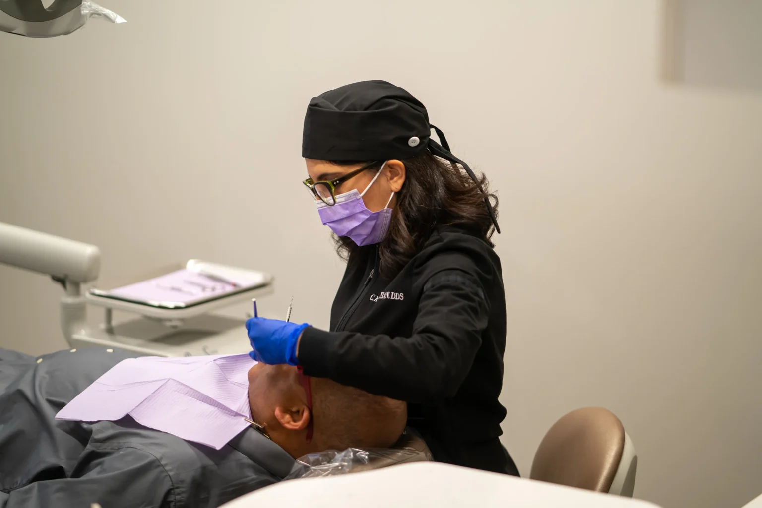 Dental Professional Providing Patient Examination And Care